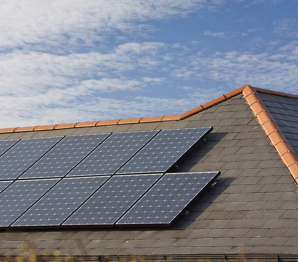 solar panels on a roof during a sunset | SunState Solar