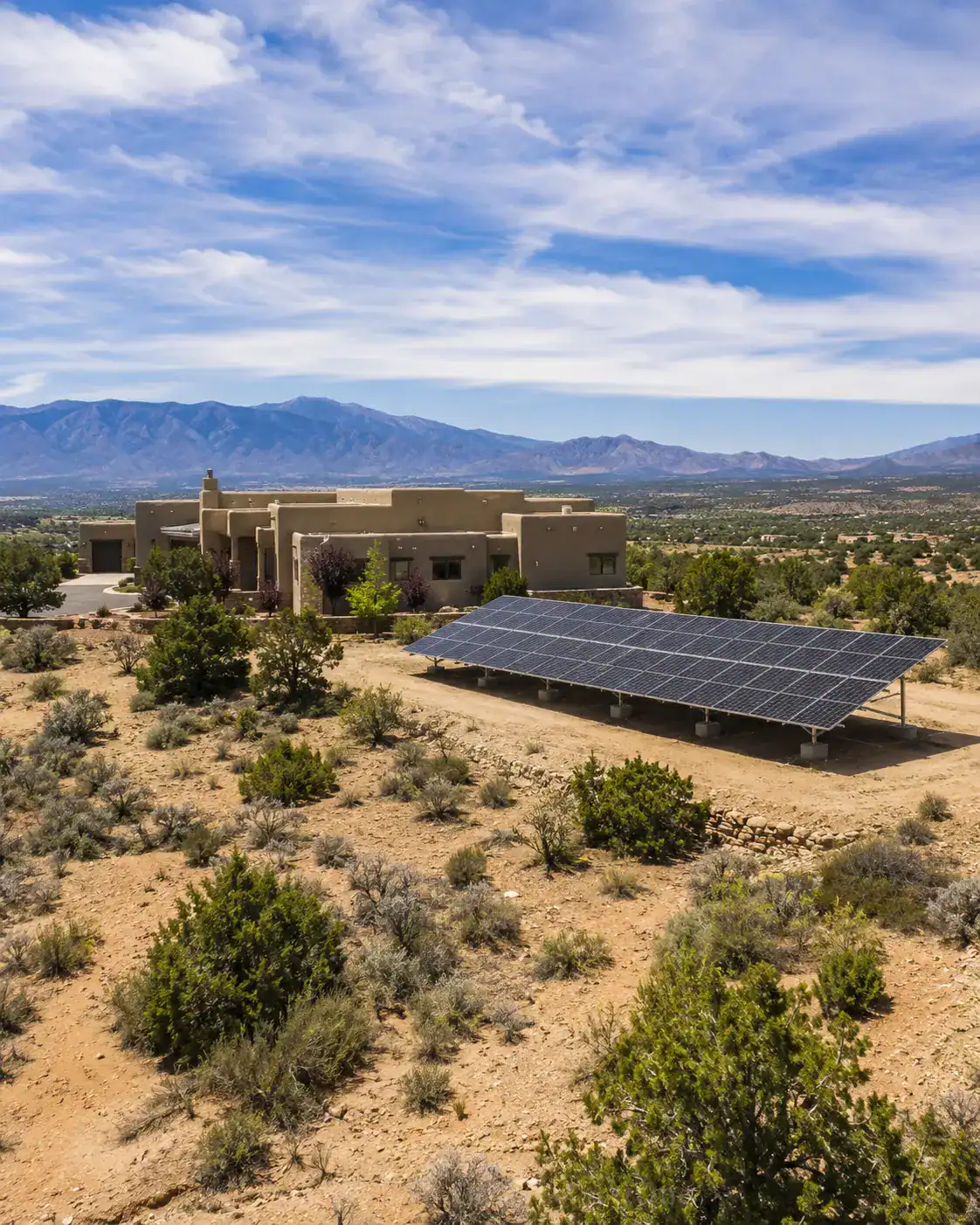 Ground-mounted solar panels at a custom home in Placitas, New Mexico